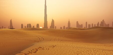 Dubai city skyline at sunset seen from the desert (iStock/adrian825)