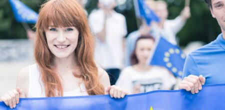 Young woman with flag of European Union (iStock/KatarzynaBialasiewicz)