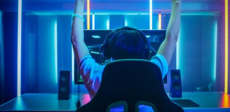 Professional Gamer Playing and Winning (iStock/gorodenkoff)