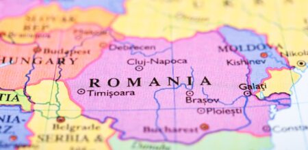 Close-up of colored map of Europe zoomed in on Romania (iStock/Bigandt_Photography)