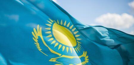 Wind develops flag of the Republic of Kazakhstan (iStock/freedarst)