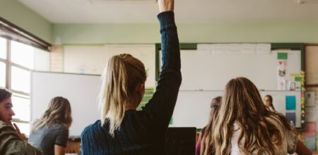 Rear view of students sitting in the class (iStock/jacoblund)