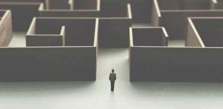 Man lost in a complex maze (iStock/francescoch)