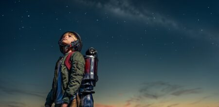 Boy with a backpack at night